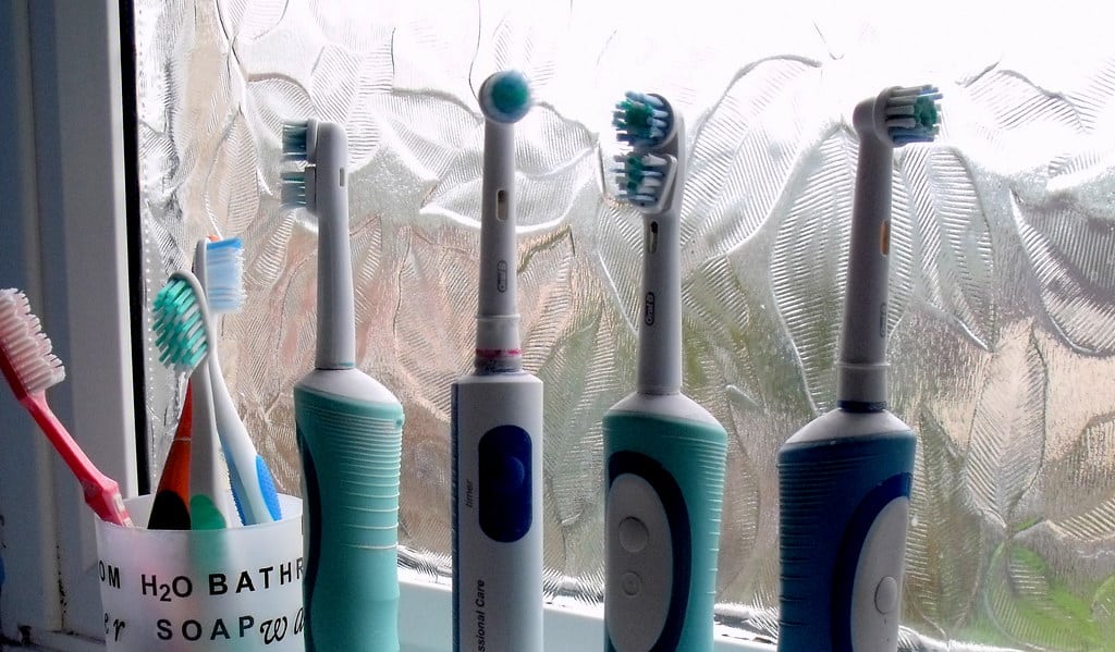 Toothbrushes next to a window