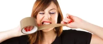 Woman Using her Teeth on Tape